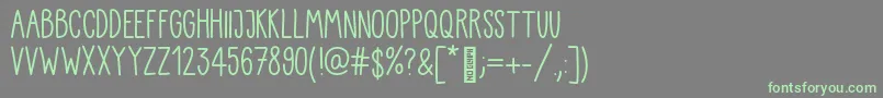 Kiddo Handwriting-Schriftart – Grüne Schriften auf grauem Hintergrund