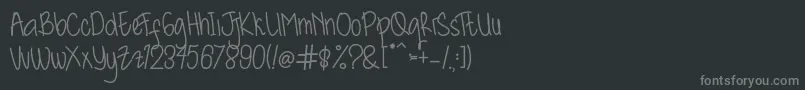 フォントKidosplay Bold – 黒い背景に灰色の文字