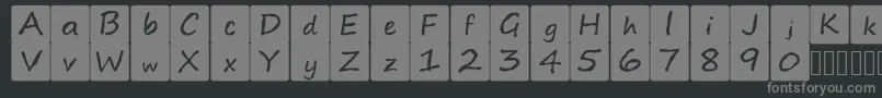 kidsboardgamefont-fontti – harmaat kirjasimet mustalla taustalla