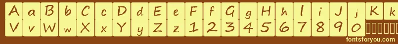 kidsboardgamefont Font – Yellow Fonts on Brown Background