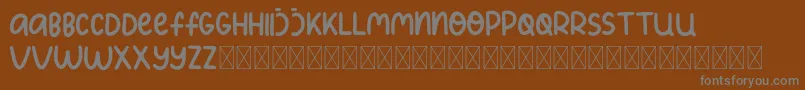 KidsPlanet Font – Gray Fonts on Brown Background