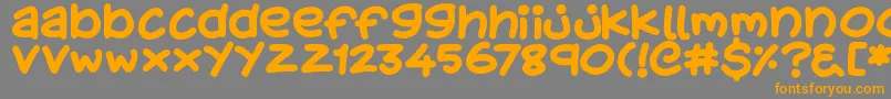 フォントKidsStuff – オレンジの文字は灰色の背景にあります。