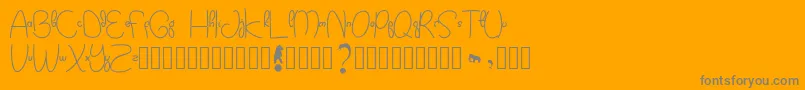 Kidtoy-Schriftart – Graue Schriften auf orangefarbenem Hintergrund