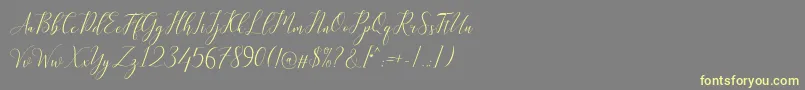 Kimberly Font – Yellow Fonts on Gray Background