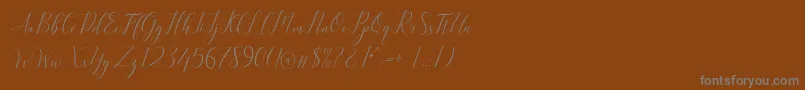 Kimberly Font – Gray Fonts on Brown Background