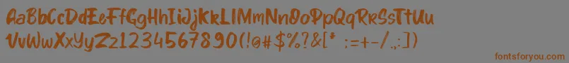 Шрифт kinder Boy font – коричневые шрифты на сером фоне