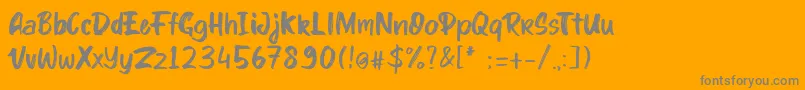 kinder Boy font-fontti – harmaat kirjasimet oranssilla taustalla