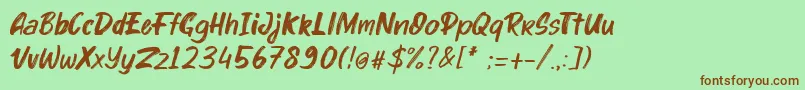 kinder Boy Italic-Schriftart – Braune Schriften auf grünem Hintergrund