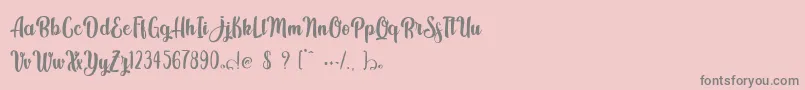 Fonte Kindly Jasmine – fontes cinzas em um fundo rosa