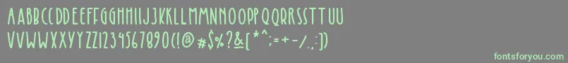 Kinglet Cute-Schriftart – Grüne Schriften auf grauem Hintergrund