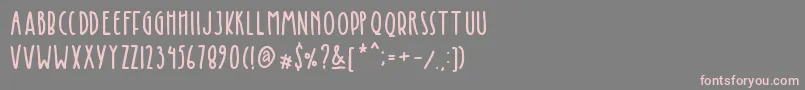 Kinglet Cute-Schriftart – Rosa Schriften auf grauem Hintergrund