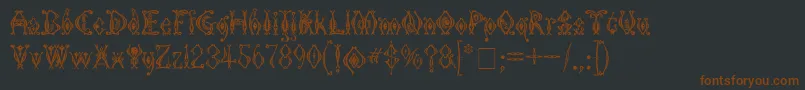 Шрифт Kingthings Tendrylle – коричневые шрифты на чёрном фоне