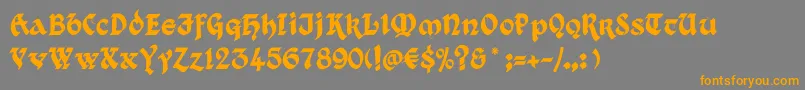 フォントKingthings Xander – オレンジの文字は灰色の背景にあります。