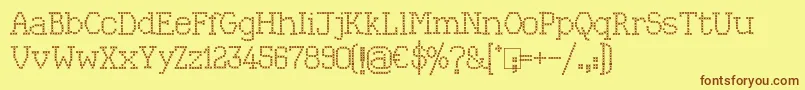 Kingthings Xstitch-Schriftart – Braune Schriften auf gelbem Hintergrund