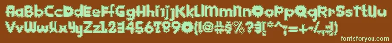 フォントKINKEE   – 緑色の文字が茶色の背景にあります。