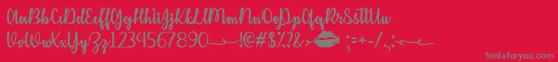 Kiss Me or Not  -Schriftart – Graue Schriften auf rotem Hintergrund