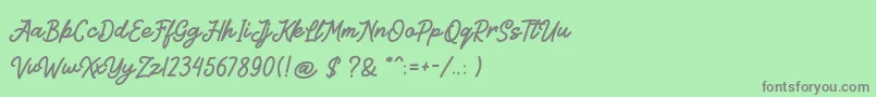 Kitabisa-Schriftart – Graue Schriften auf grünem Hintergrund