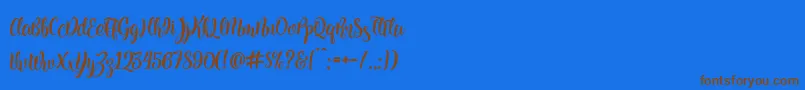 Kite Script Font – Brown Fonts on Blue Background