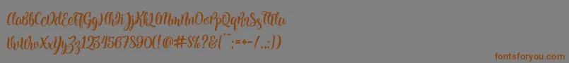Kite Script Font – Brown Fonts on Gray Background