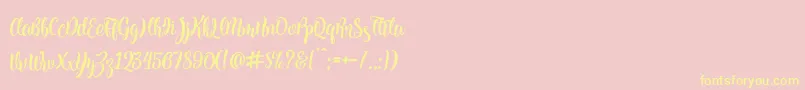 Kite Script-fontti – keltaiset fontit vaaleanpunaisella taustalla