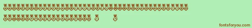 Kitties Font – Brown Fonts on Green Background