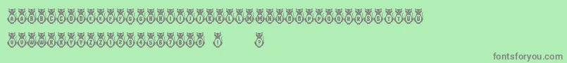 Kitties Font – Gray Fonts on Green Background