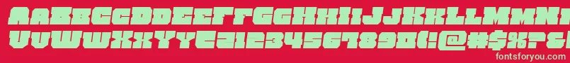 kittricksemital-Schriftart – Grüne Schriften auf rotem Hintergrund