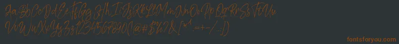 Kiysoom Demo Font – Brown Fonts on Black Background