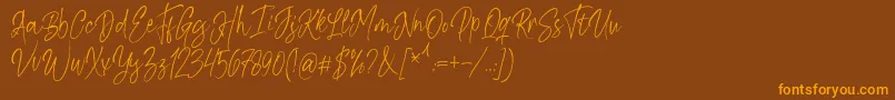 Шрифт Kiysoom Demo – оранжевые шрифты на коричневом фоне