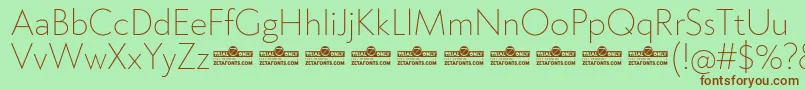 フォントKlein ExtraLight trial – 緑の背景に茶色のフォント