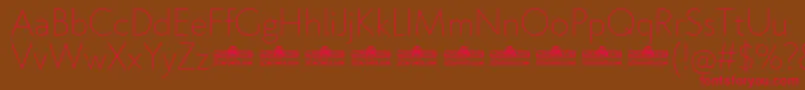 フォントKlein ExtraLight trial – 赤い文字が茶色の背景にあります。