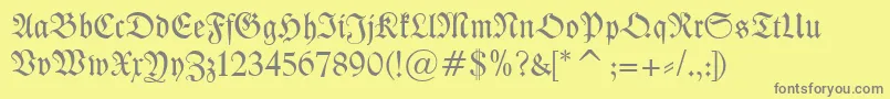Kleist Fraktur-fontti – harmaat kirjasimet keltaisella taustalla