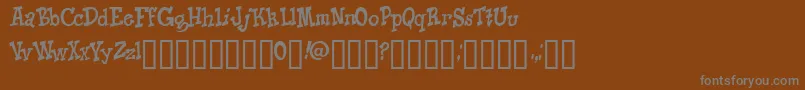KNICO   -fontti – harmaat kirjasimet ruskealla taustalla
