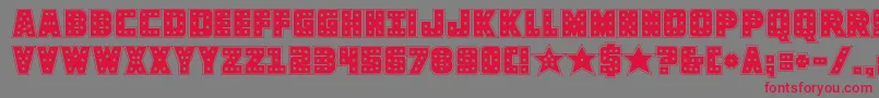フォントknievelacad – 赤い文字の灰色の背景