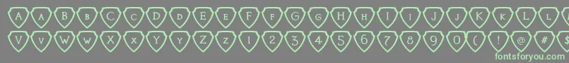フォントKnights Quest Shielded – 灰色の背景に緑のフォント