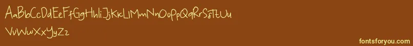 Fonte KoalaKumal Handwriting – fontes amarelas em um fundo marrom