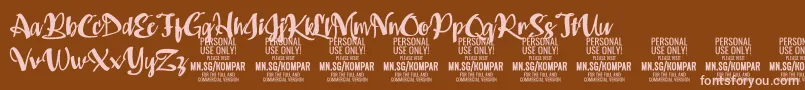 フォントKompar Bold PERSONAL USE ONLY – 茶色の背景にピンクのフォント
