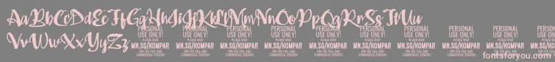 Kompar Bold PERSONAL USE ONLY-Schriftart – Rosa Schriften auf grauem Hintergrund