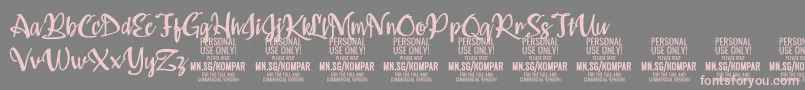 Kompar Medium PERSONAL USE ONLY-Schriftart – Rosa Schriften auf grauem Hintergrund