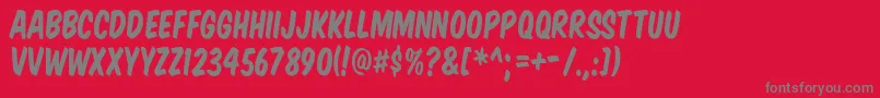 フォントKOMTIT   – 赤い背景に灰色の文字