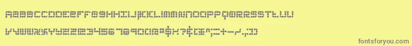 koneerie-fontti – harmaat kirjasimet keltaisella taustalla