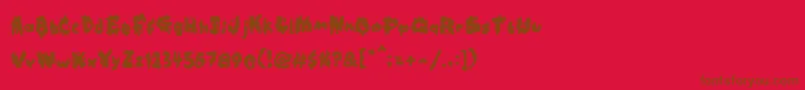 Kookaburra-Schriftart – Braune Schriften auf rotem Hintergrund