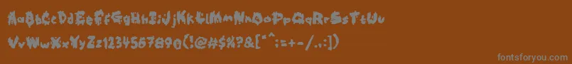 Kookaburra-Schriftart – Graue Schriften auf braunem Hintergrund