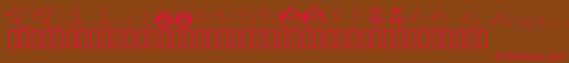 フォントKR All Smiles – 赤い文字が茶色の背景にあります。