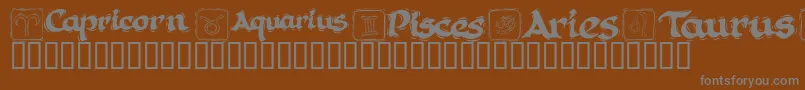 KR Astro 1-fontti – harmaat kirjasimet ruskealla taustalla