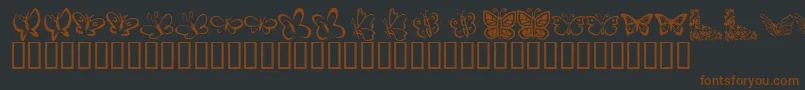 KR Butterflies Font – Brown Fonts on Black Background