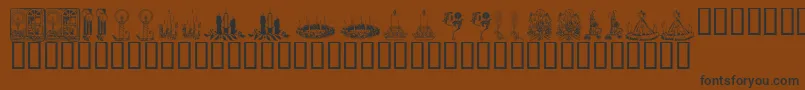 KR Christmas Candles Font – Black Fonts on Brown Background