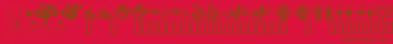 KR Christmas Dings 2004 Six-Schriftart – Braune Schriften auf rotem Hintergrund