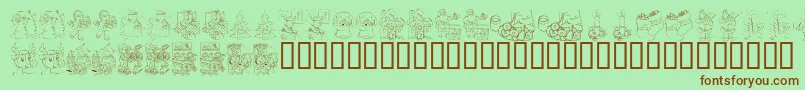 Fonte KR Color Me Christmas 2002 – fontes marrons em um fundo verde