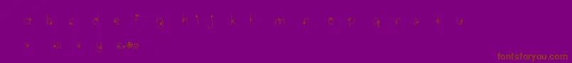 フォントMtfWildflower – 紫色の背景に茶色のフォント